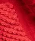 Gros plan sur le tissu peluche rouge texturé de la peluche homard pour chien