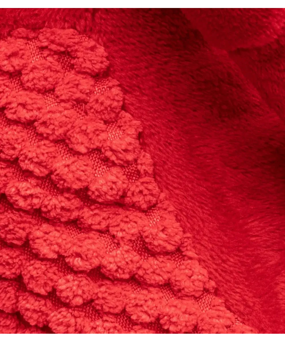 Gros plan sur le tissu peluche rouge texturé de la peluche homard pour chien
