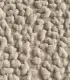 Gros plan sur le tissu bouclé beige texturé du lit pour chien Bellagio, Bella Concept Store Dog